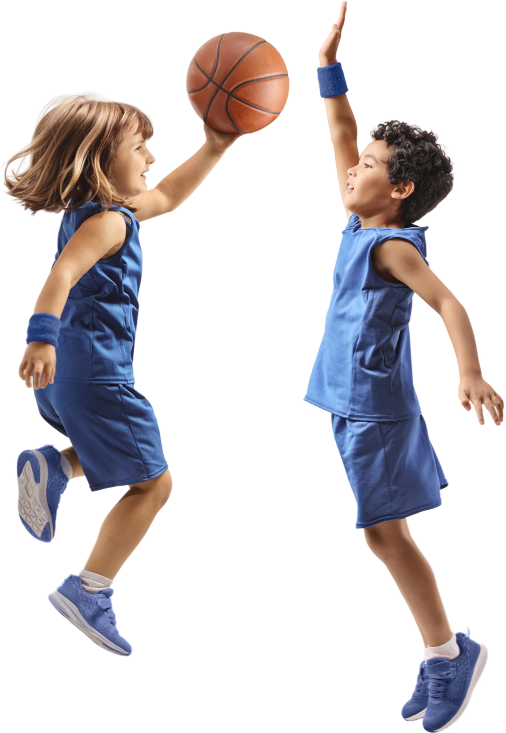 Kids playing basketball mid-air jump shot.